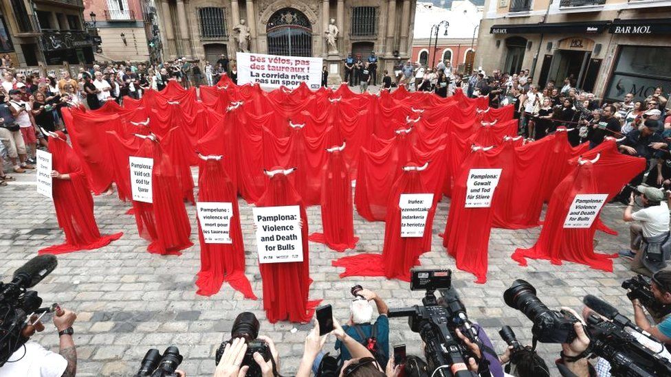 Members of the animal rights organizations 'AnimaNaturalis' and 'PETA' stage a protest in Pamplona, the capital of the Navarre region in northern Spain, against the mistreatment of animals during the Sanfermines fiesta, 05 July 2023.