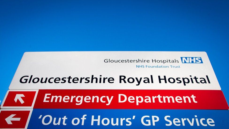 A sign outside the Gloucestershire Royal Hospital showing the way to different departments