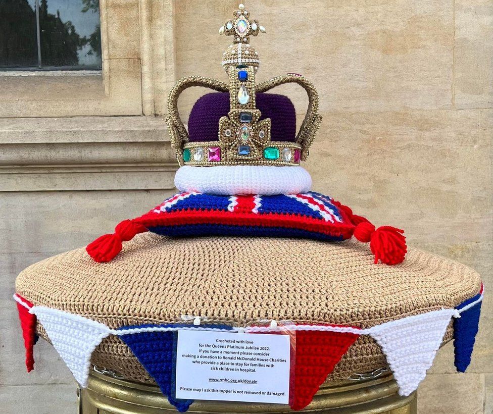 A crocheted jubilee crown on a gold postbox by St Paul's Square
