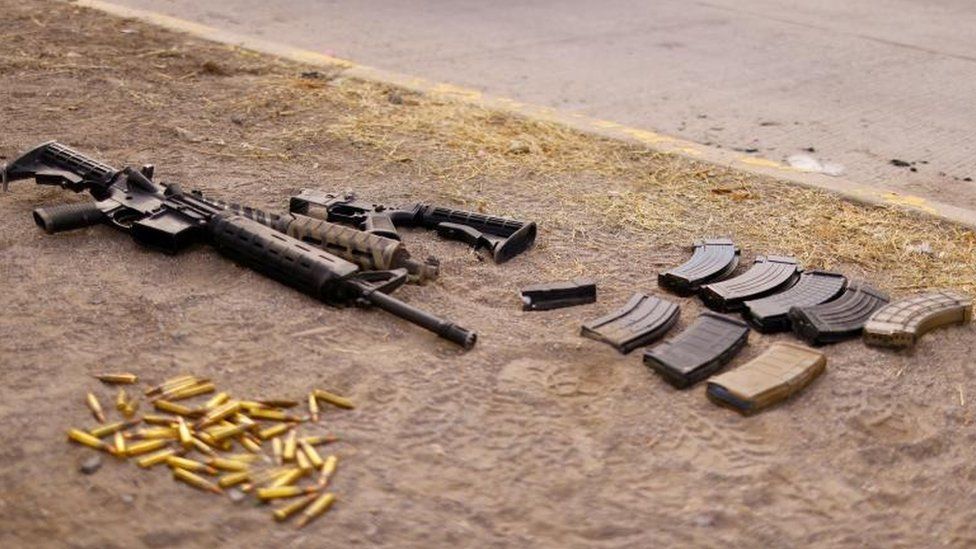 Guns and bullets are seen in front of the Cereso state prison number 3 secured by the security Forces after unknown assailants entered the prison and freed several inmates, resulting in injuries and deaths, according to local media, in Ciudad Juarez, Mexico January 1, 2023.