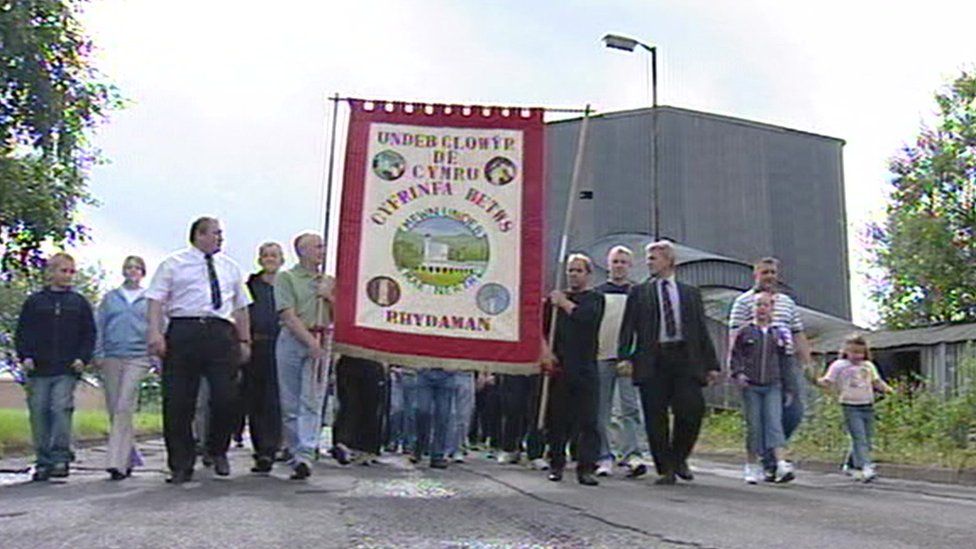 miners walking with banner