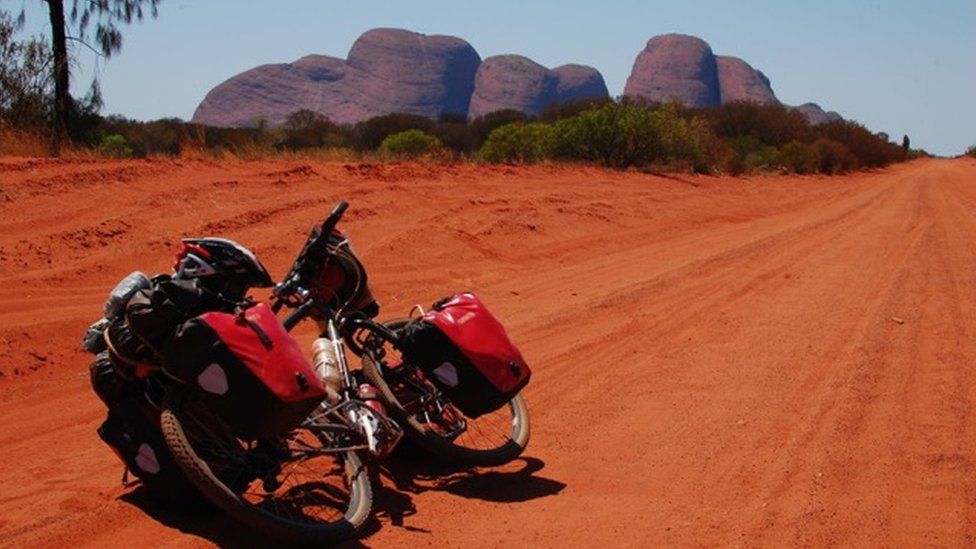 the bike on the path in the Australian desert