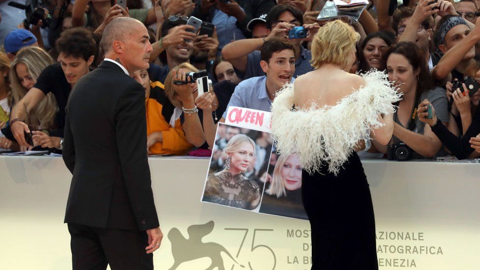 Cate Blanchett and her bodyguard Agostino Spinella (L) on the red carpet ahead of the 'A Star Is Born' screening during the 75th Venice Film Festival at Sala Grande on August 31, 2018