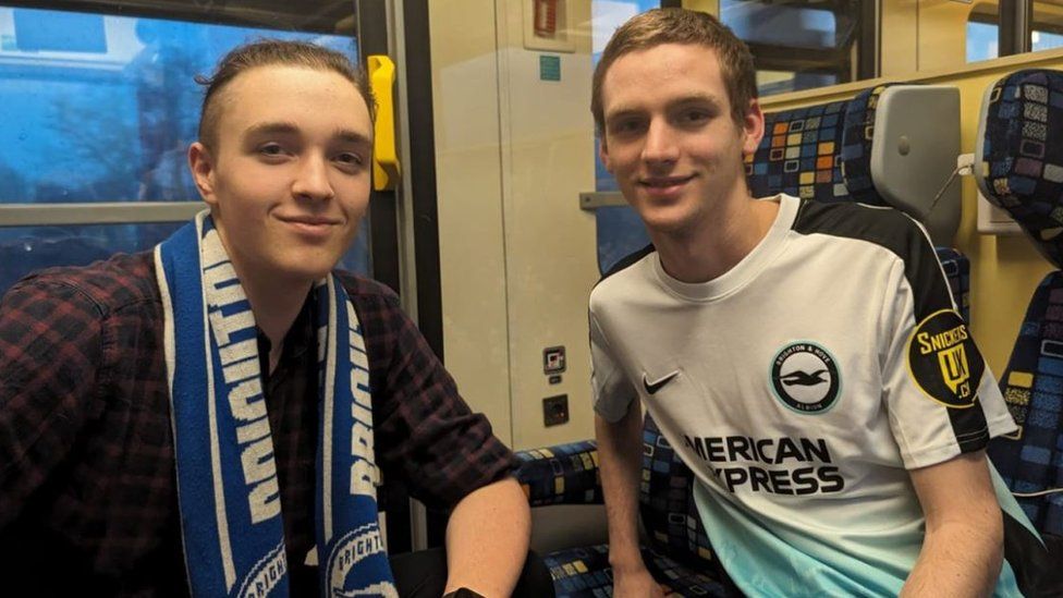 Mikey Farr and his friend Thor on a train