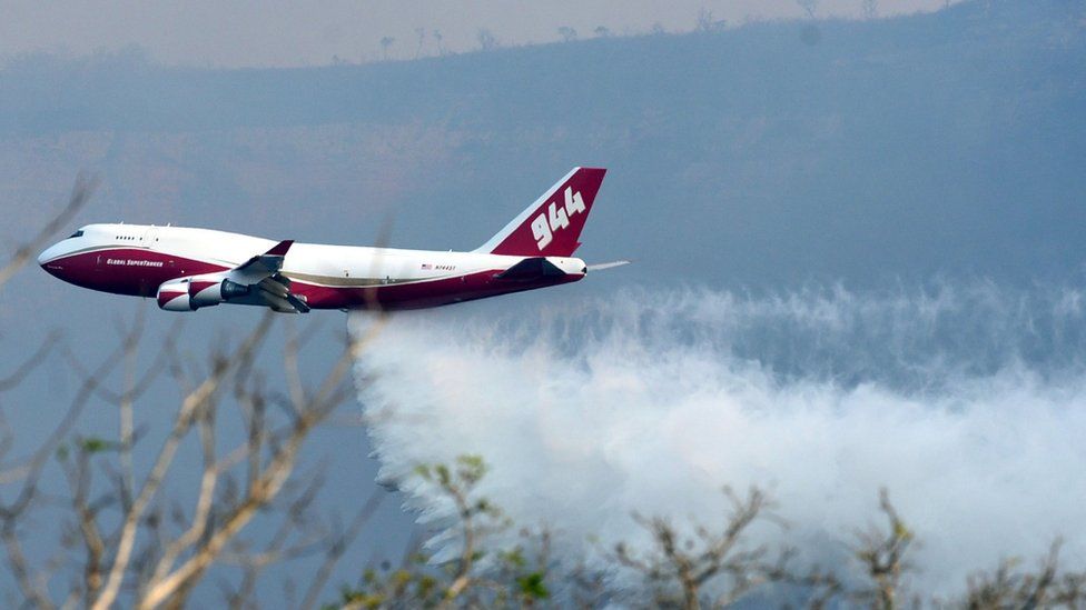 View of a Supertanker, an aerial firefighting airtanker, overflying the fires raging near Robore, Santa Cruz region, eastern Bolivia on August 23, 2019.