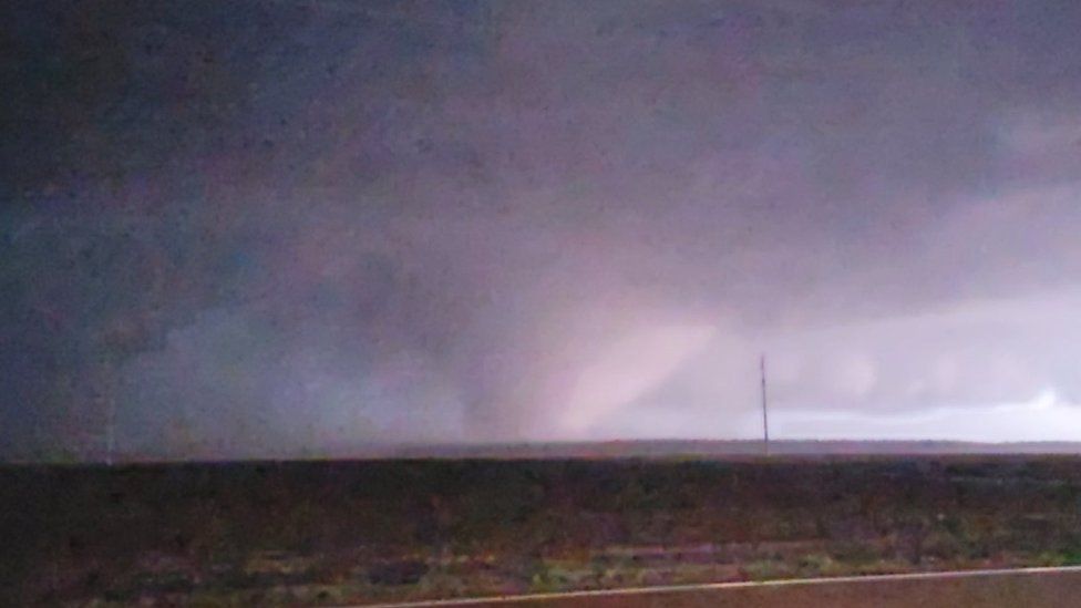 A photo of the tornado taken by a storm watcher as it rolled in