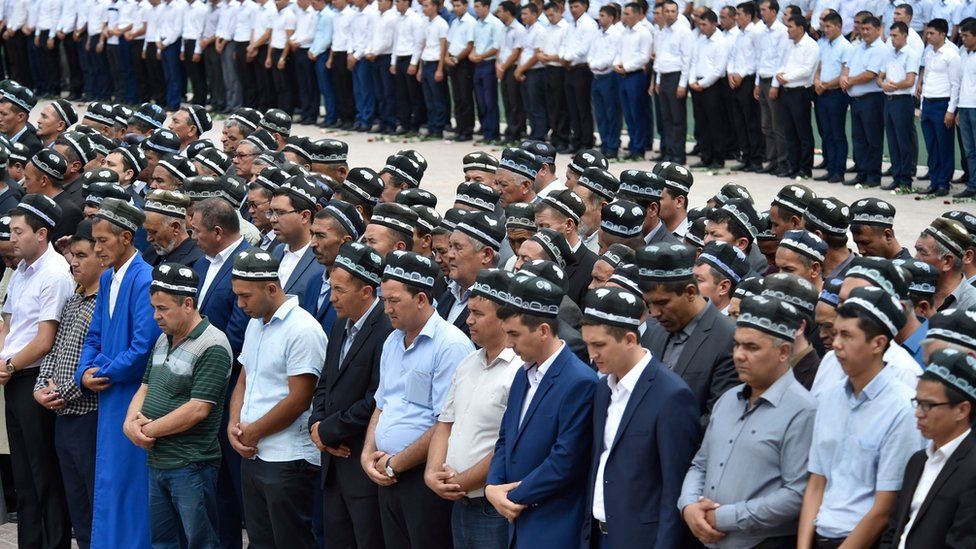 Uzbek men pray as they gather to pay the last respects, during the funeral of President Islam Karimov at the historic Registan Square in Samarkand, Uzbekistan, Saturday, Sept. 3, 2016.