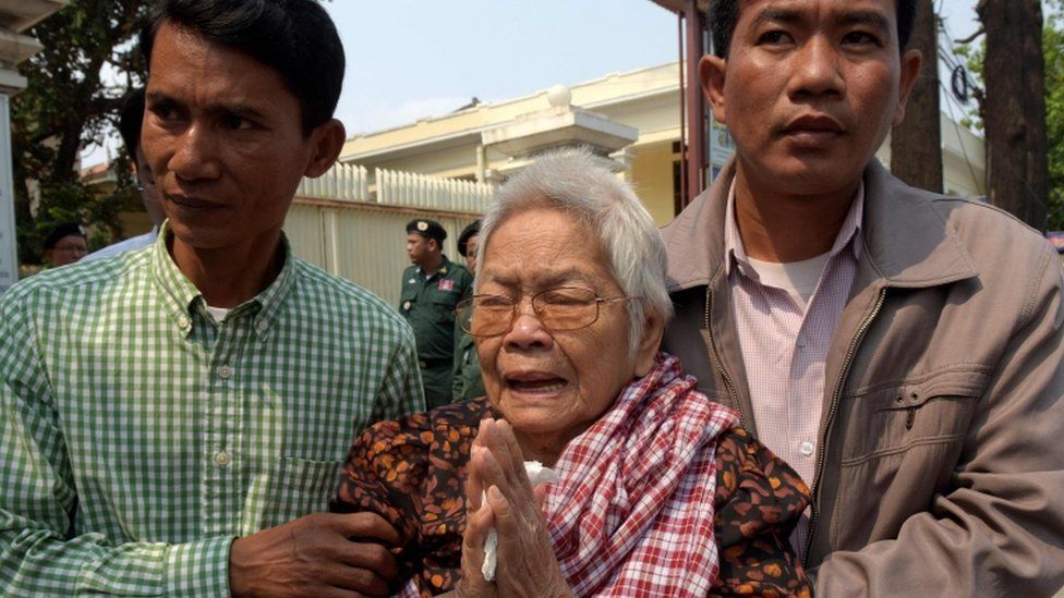 Sao Nget, led away by two men, while crying outside court on 1 Feb