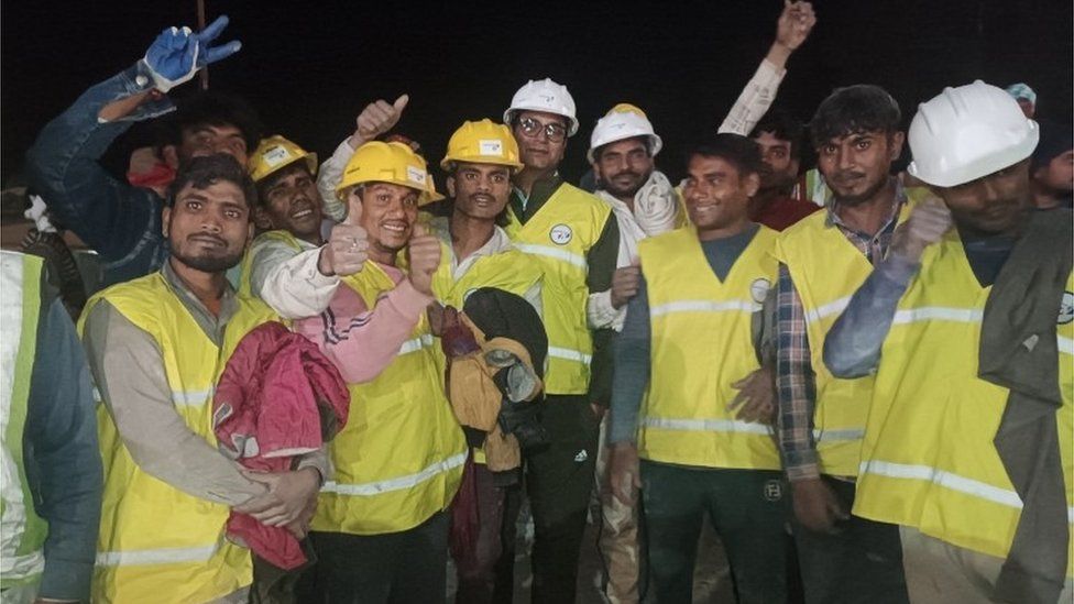 A handout photo made available by Uttarakhand"s Department of Information and Public Relation (DIPR) shows workers following their rescue from inside the under-construction Silkyara tunnel on the Brahmakal Yamunotri National Highway in Uttarkashi, India, 28 November 2023.