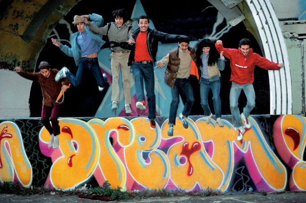 Duro, Doze, Mare 139, Shy 147, Daze, Lady Pink, and Crash jumping off the East River Park amphitheatre, Manhattan, 1981