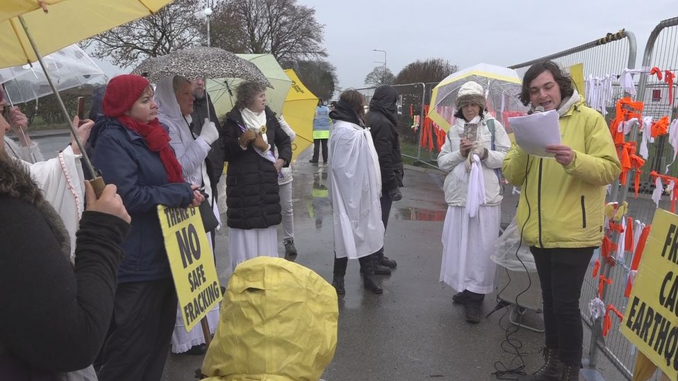 A poet urges solidarity against fracking during the protest