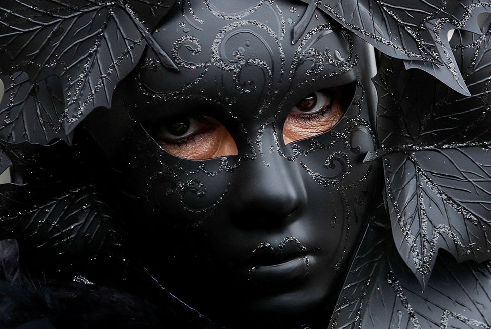 A masked reveller takes part in the Venice carnival in Venice, Italy. 5 February 2023.