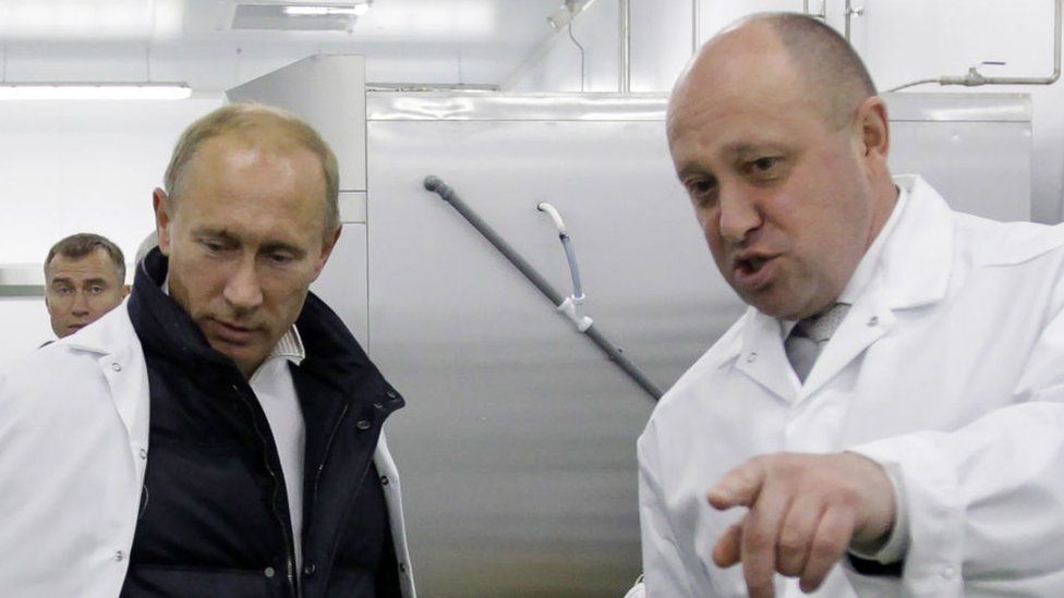 Yevgeny Prigozhin shows Russian Prime Minister Vladimir Putin his school lunch factory outside Saint Petersburg on September 20, 2010