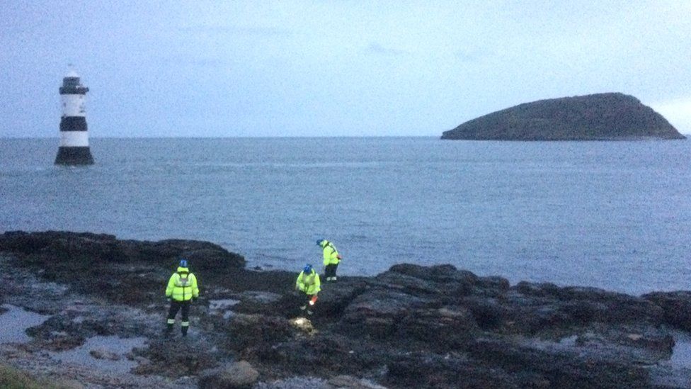Coastguard volunteers begin searching the coast at Penmon