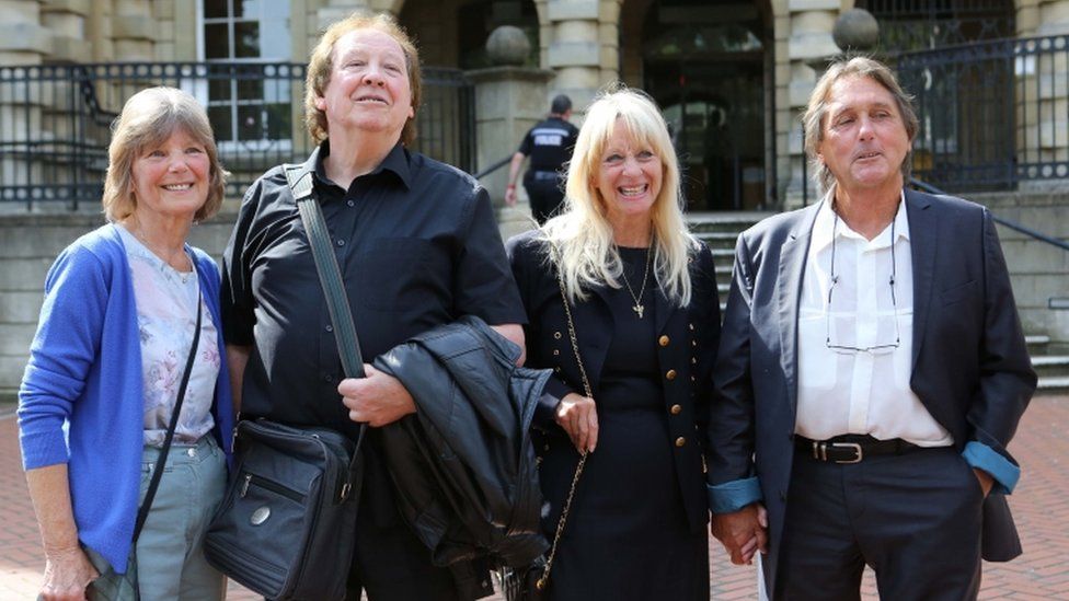 Richard Westwood, 73 (second left) and Leonard "Chip" Hawkes, 70 (far right) with their wives Lynn (left) and Carol outside court