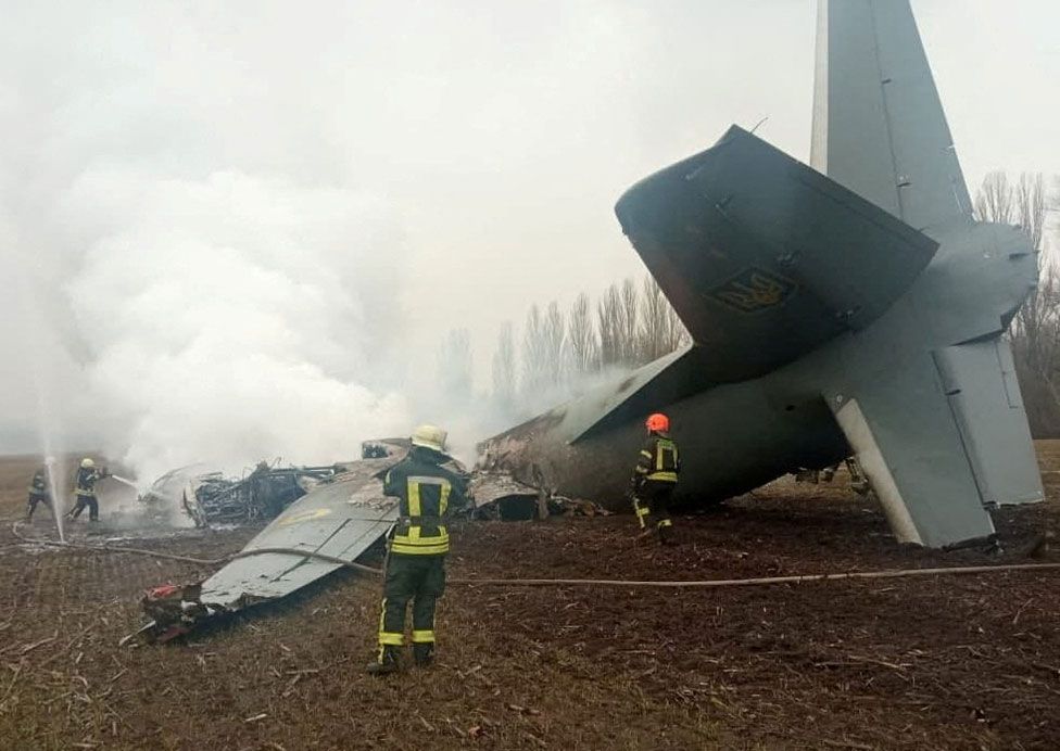 Rescuers work at the crash site of a Ukrainian Armed Forces' Antonov aircraft, shot down in the Kyiv region, Ukraine