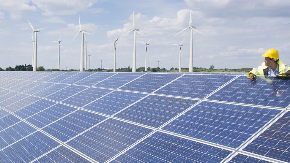 Man checking solar panels