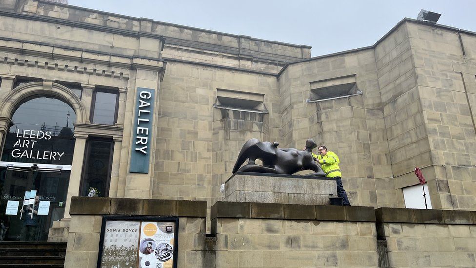 The Henry Moore sculpture being cleaned
