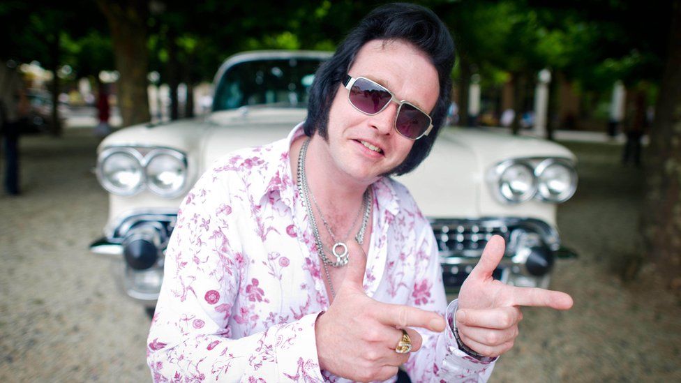 Elvis impersonator Philipp Lieder with a classic Cadillac at the 14th European Elvis Festival in Bad Nauheim