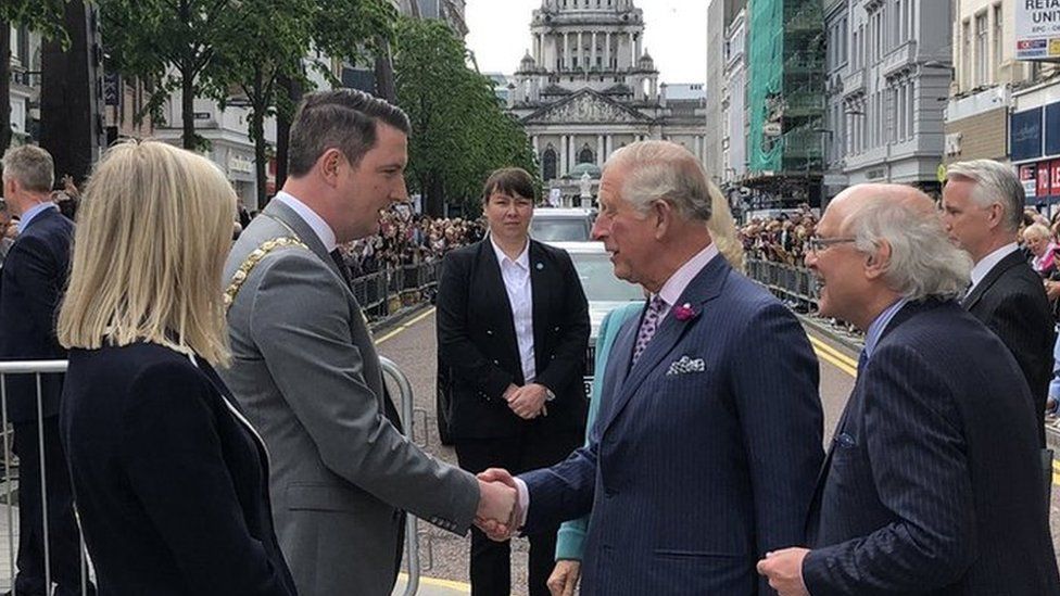 Prince Charles is greeted by the new Sinn Féin Lord Mayor of Belfast, John Finucane