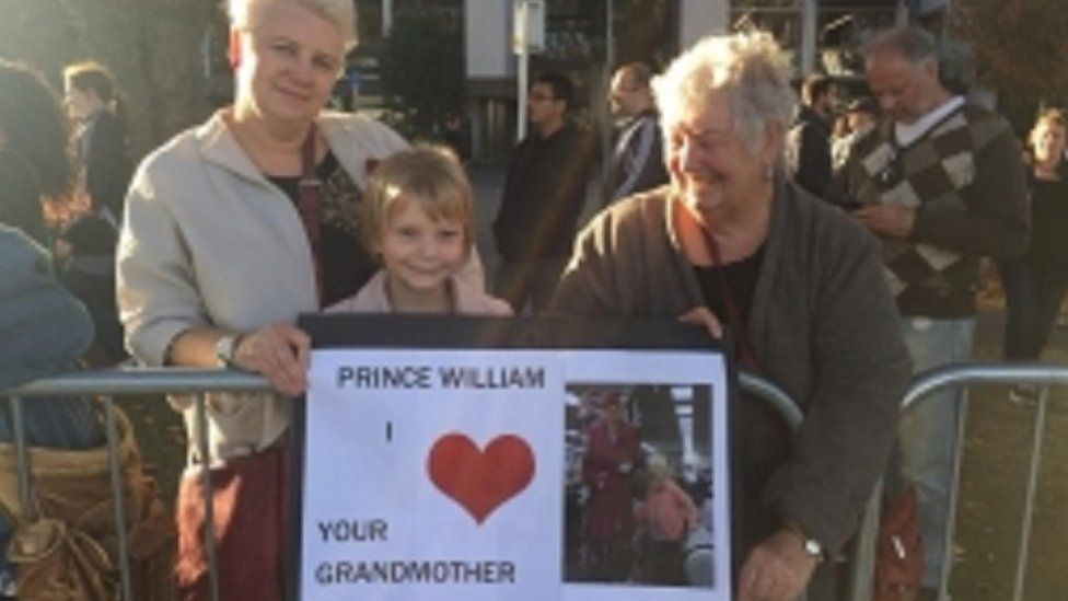 Tilly holds her sign to welcome the prince