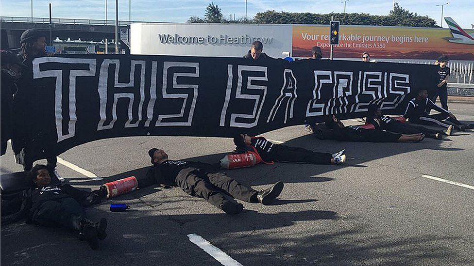 Black Lives Matter protesters lying on the road which has brought traffic heading to Heathrow airport to a standstill