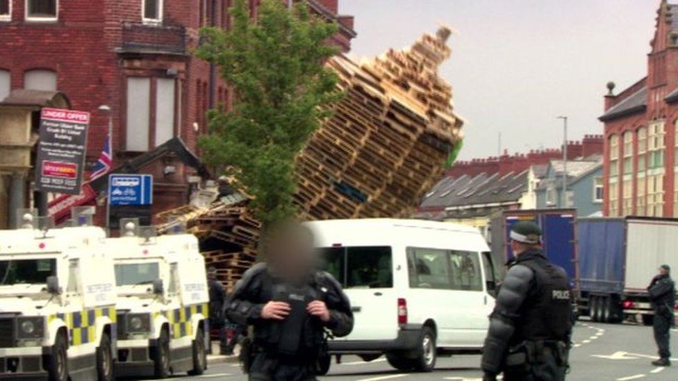 Police at scene of bonfire in Cluan Place