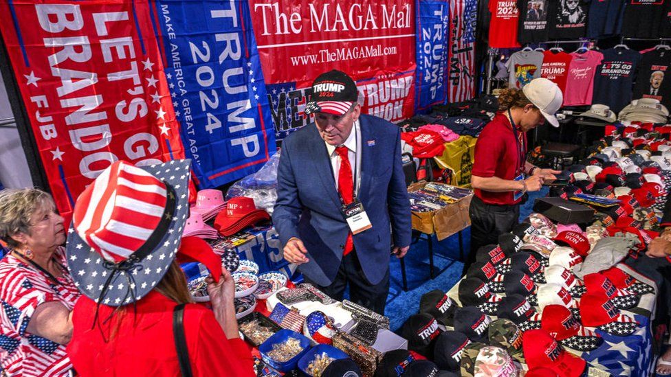 Donald Trump fans sell merchandise at the Turning Point Action USA conference