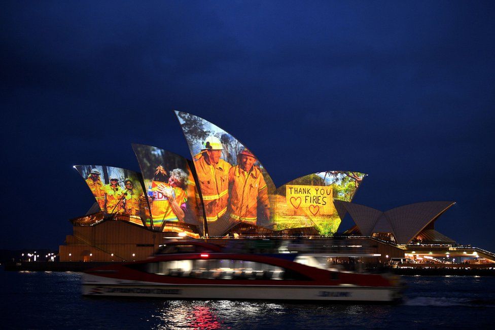 The sails of the Opera House in Sydney are lit with a series of images to show support for the communities affected by the bushfires and to express the gratitude to the emergency services and volunteers