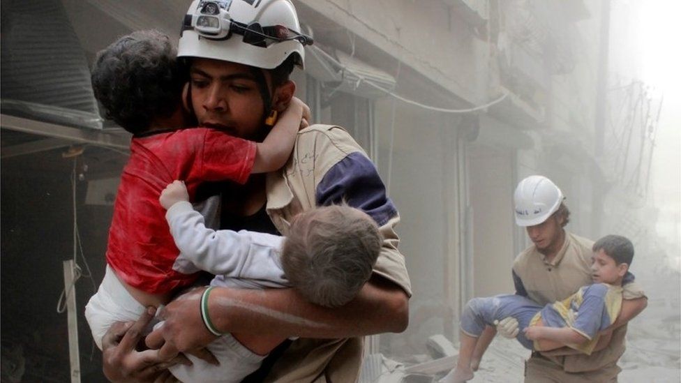 White Helmet volunteers rescuing children in Aleppo (file photo)