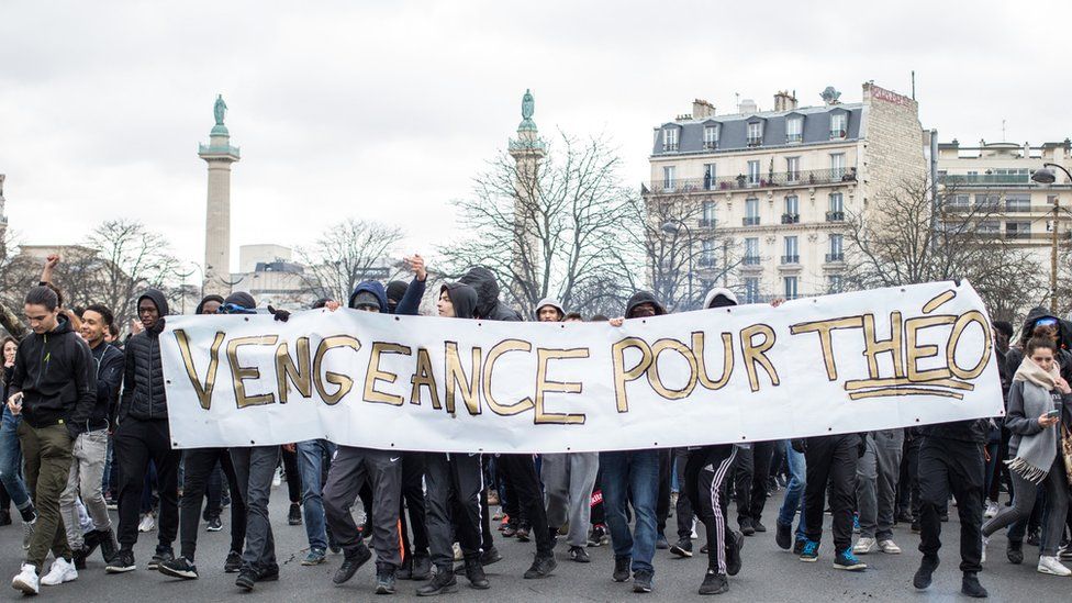 High school students gather during a demonstration at place de la Nation in tribute to Theo Luhaka, a young man seriously wounded and allegedly raped during a police control in Aulnay sous bois northern Paris,