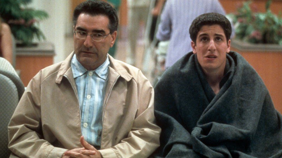 Eugene Levy and Jason Biggs in waiting room in a scene from the film 'American Pie 2', 2001