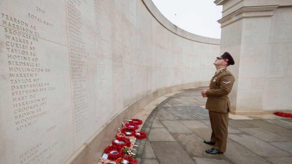 A man pays his respects at the National Memorial Arboretum in Alrewas in Nov 2020