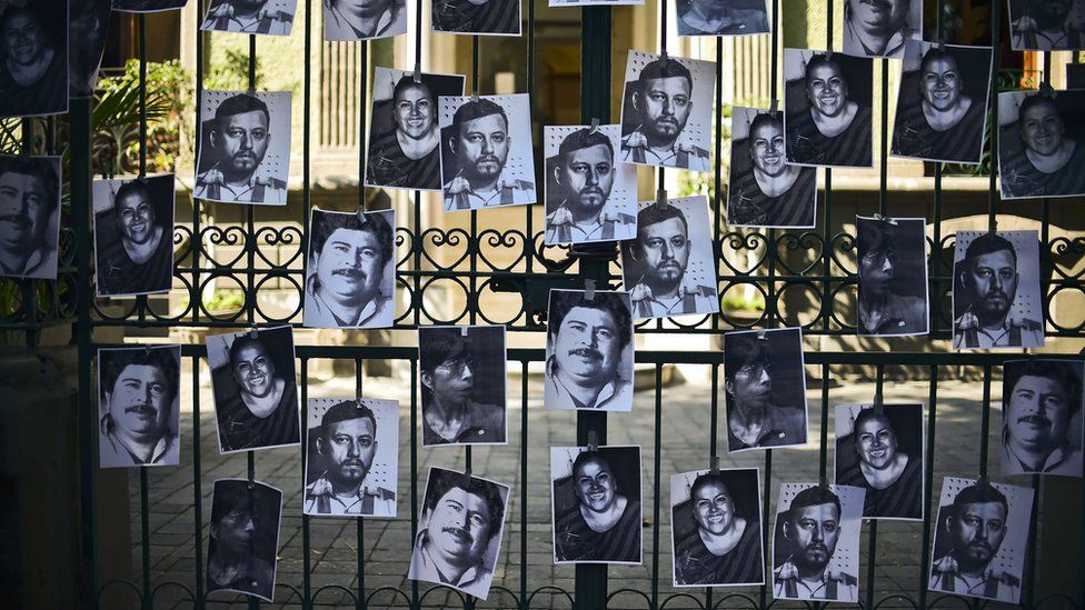 VIew of photos of killed journalists stuck on the fence of the Veracruz state representation office during a journalists protest in Mexico City on 11 February, 2016