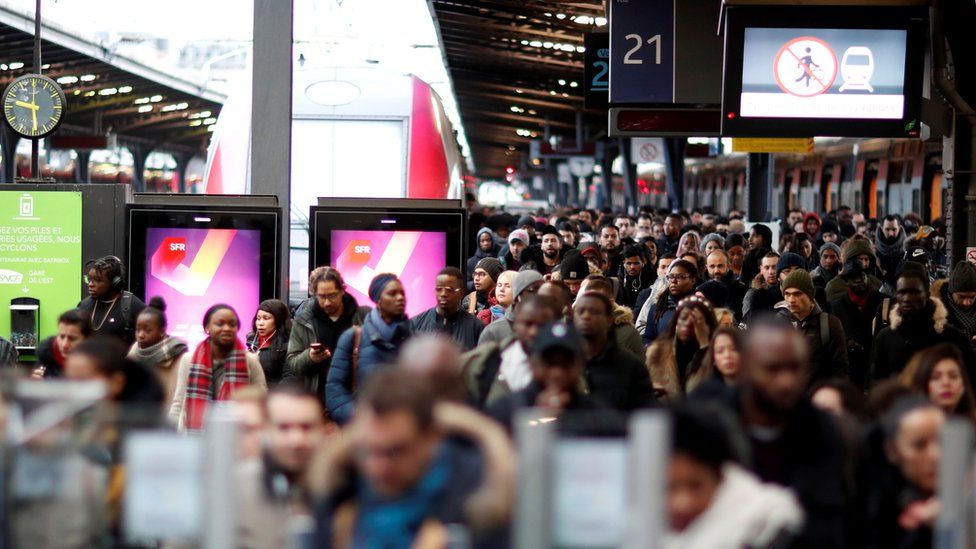 Commuters at France's Gare de l'Est train station during a strike by all unions of French SNCF and the Paris transport network (RATP) in Paris, 23 December 2019