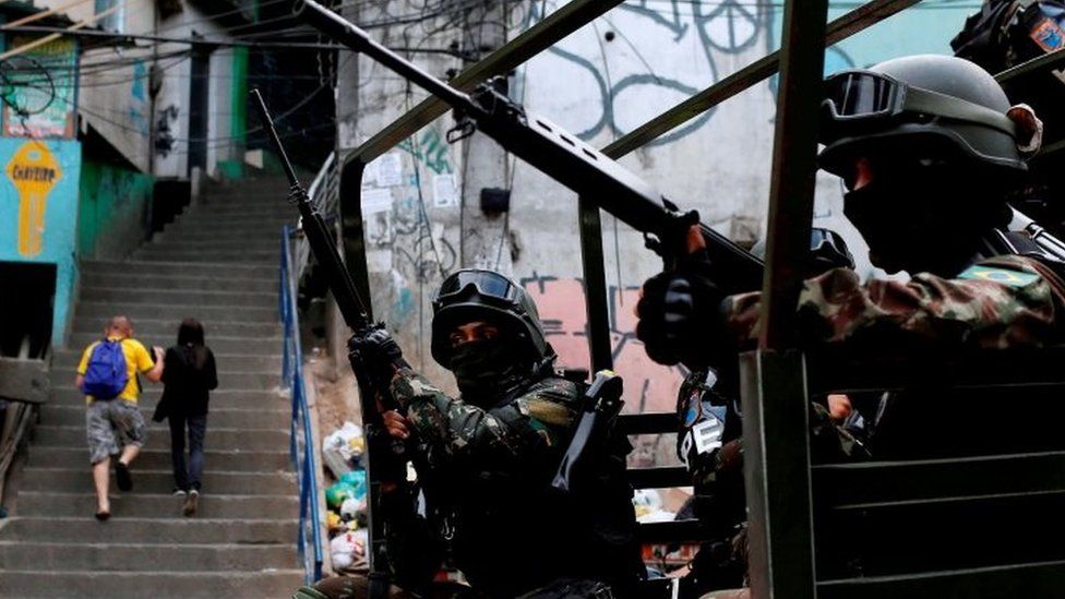 Armed Forces take up position during a operation after violent clashes between drug gangs in Rocinha slum in Rio de Janeiro, Brazil, September 22, 2017.