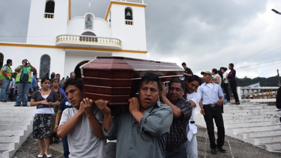 Relatives of a victim of Thursday's landslide in the village of El Cambray II - take the coffin to the municipal cemetery of Santa Catarina Pinula municipality, some 15 km east of Guatemala City, on October 4, 2015