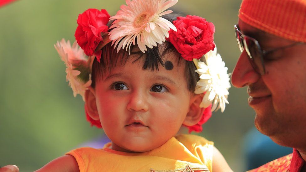 A young girl watches Bengali new year celebrations