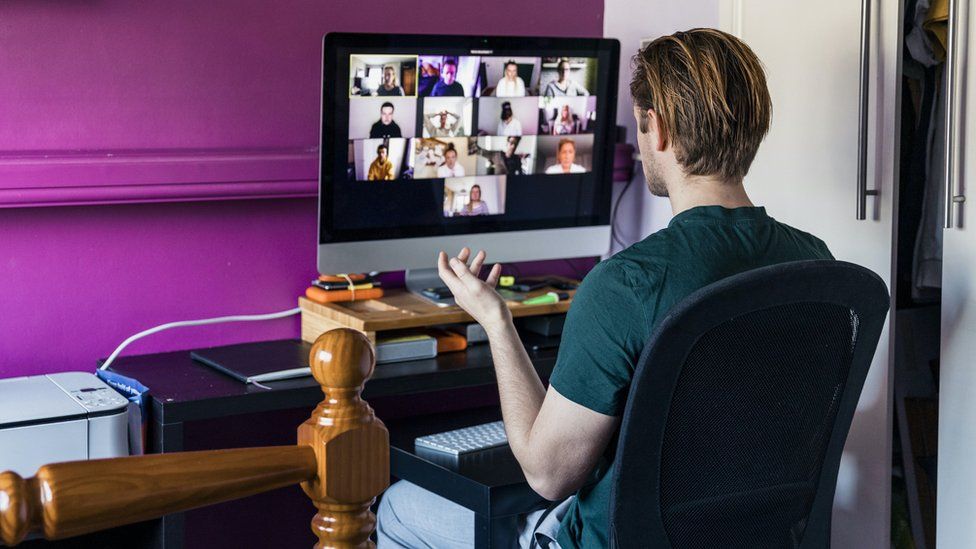 Stock shot of a man on a conference call