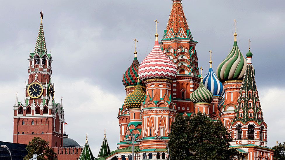 A view of Saint Basil Cathedral (Pokrovsky Cathedral) and Spasskaya clock Tower of Moscow Kremlin on Red Square