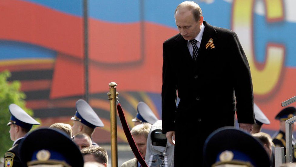 Prime Minister of Russia Vladimir Putin looks on as soldiers march in the annual Victory Day military parade at Red Square May 9, 2008 in Moscow, Russia