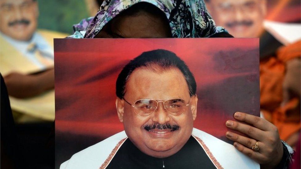 Supporters of Pakistan"s Muttahida Qaumi Movement (MQM) party hold photographs of party leader Altaf Hussain as they stage a sit-in calling for his release in Karachi on June 3, 2014.
