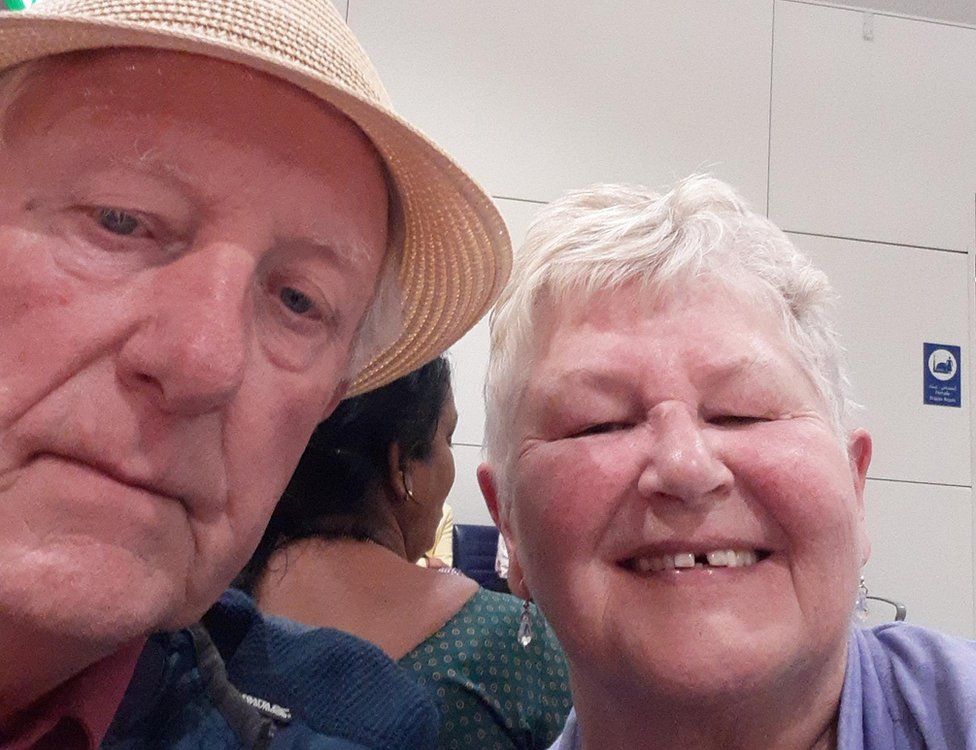 Margaret and Derek McArthur take a selfie while waiting at the international airport