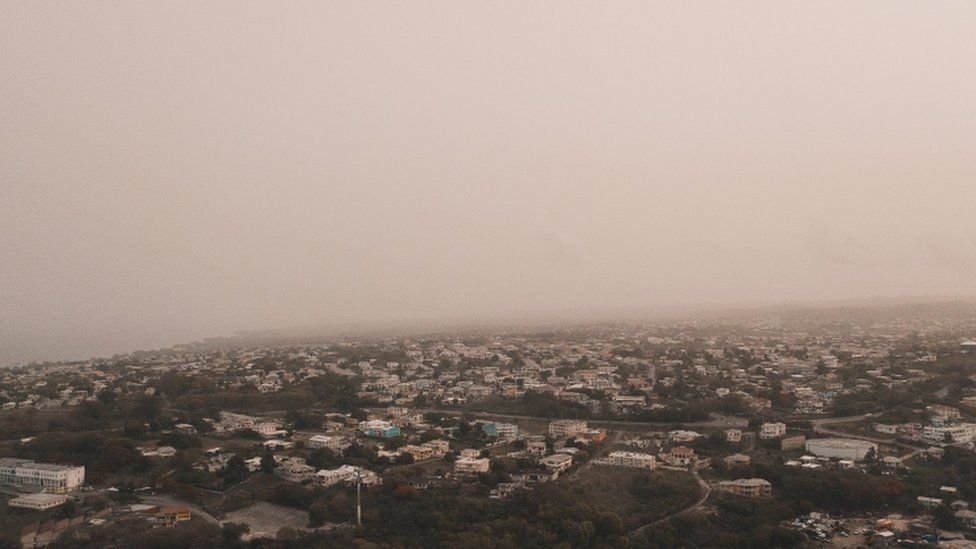 Dust coming from the Sahara desert floats over the city of Bridgetown, Barbados, June 22, 2020, in this picture obtained from social media