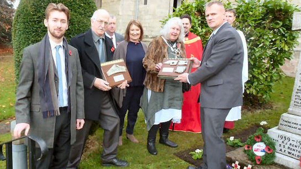 Parts of crashed WW2 plane given to family members - BBC News