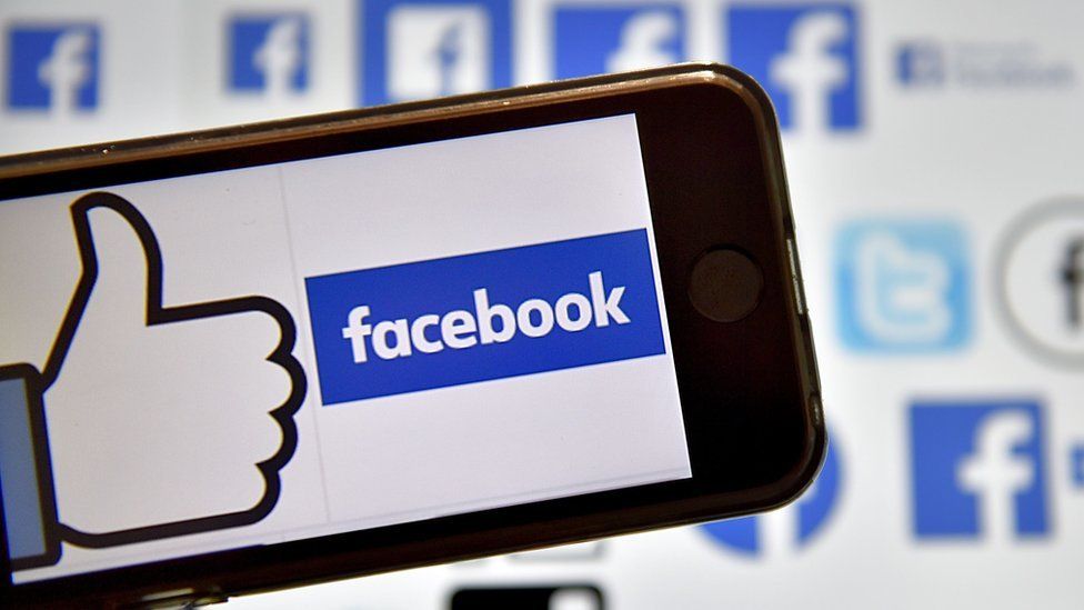 The Facebook logo displayed on a smartphone screen.