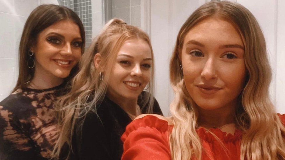 Chloe Ward (centre) with two friends on the night she believes she was spiked