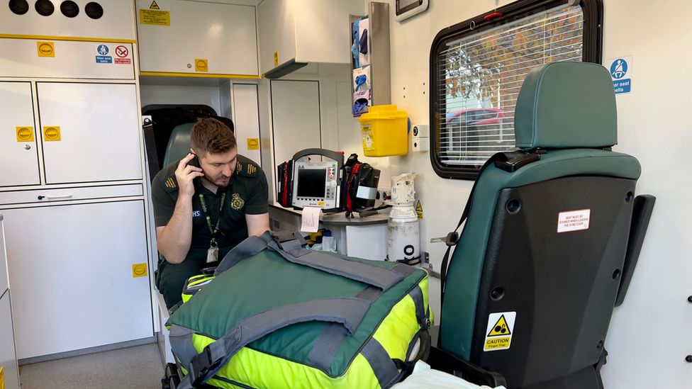 A paramedic aboard an ambulance