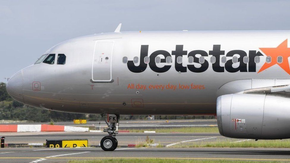 A Jetstar aircraft from Adelaide lands at Kingsford Smith Airport on November 18, 2020 in Sydney, Australia. Extra health screenings have been introduced for travellers into Sydney from South Australia following a COVID-19 cluster outbreak in Adelaide.
