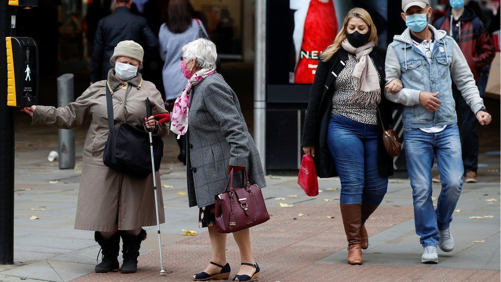 People wearing masks in Manchester